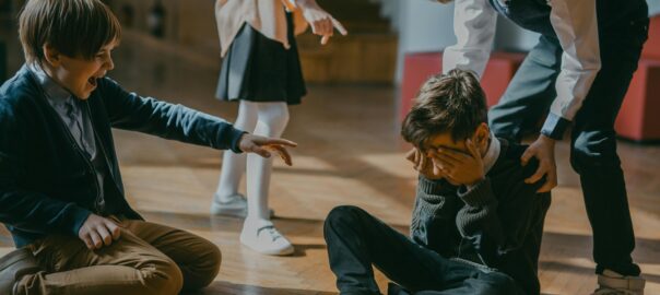 children in a school confronting a bully