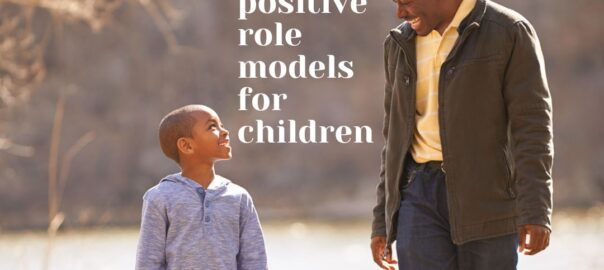 a dad and son walking while the dad explains why being a positive role model is a good trait in a father